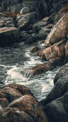 Poster - Rocky coastline with crashing waves at sunset creating a serene atmosphere near the water's edge