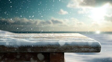 Wall Mural - snow covered wooden table on a sunny winter day by the sea with blue sky and dramatic clouds in the 