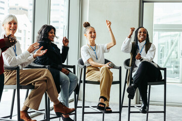 Wall Mural - diverse group of happy people engaging in a business panel presentation