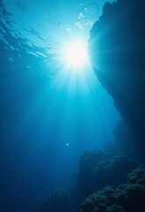 Poster - Light filters through the surface of the deep blue sea, creating a serene atmosphere with vibrant rays reaching down into the water's depths during the day. Generative AI