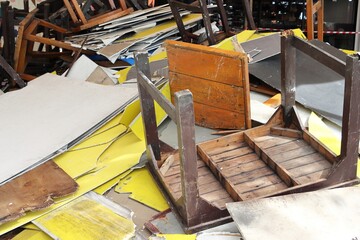 Pile of furniture junk, table chair wood and ceiling panel