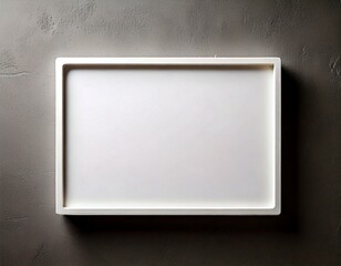 Wall Mural - A sleek, minimalist white rectangular frame mounted on a textured gray wall, creating a clean and modern aesthetic.