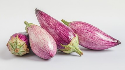 Poster - Fresh and vibrant aubergines arranged artistically on a clean white background highlighting their unique colors and textures.