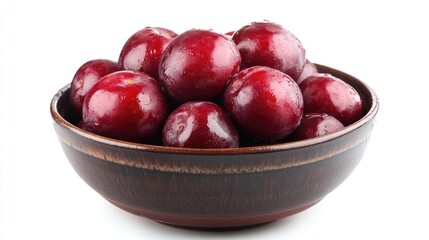 Poster - Bowl of fresh juicy red plums glistening with water droplets on a white background