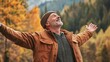 © Nathan - Smiling Caucasian man in warm jacket, embracing nature in a vibrant autumn landscape.