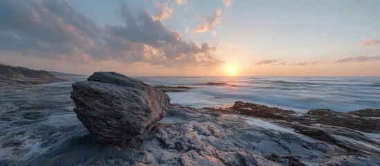 Aufkleber - Stunning HDR sunset over the ocean with natural rock formation in the foreground creating a dramatic coastal landscape scene