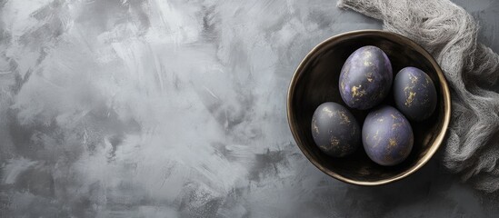 Poster - Elegant dark Easter eggs in a decorative bowl set against a textured grey background showcasing holiday traditions and seasonal decor.