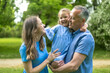 © luisrojasstock - Happy family enjoying time together in green park