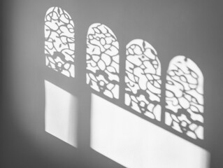 Poster - Four arched window shadows on a gray wall.
