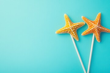 Poster - Two starfishes on sticks against blue backdrop.