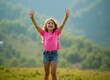 © Rick Captura - Young Girl Cheering with Hands Raised in the Air