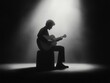 © B & W MeMiN - A silhouette of a musician playing guitar, illuminated by a spotlight, creating a dramatic and artistic atmosphere.