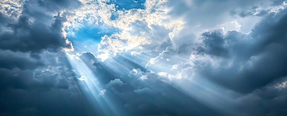 Poster - A stunning dark stormy sky with sunlight streaming through the clouds.