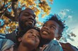 © vefimov - Father smiling at camera with two children, happy and outdoors during autumn day.