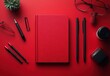 © ANUAR - Bright Red Workspace Flat Lay Featuring Stationery Items Including Notepad, Pens, Paper Clips, Glasses, and Coffee Mug on a Vibrant Background
