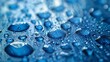 © Kenny Parker - High-resolution macro image of water droplets accentuating their clarity on smooth blue-toned surface