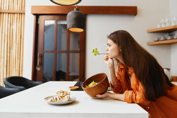 Sticker - Female model in an orange shirt enjoying a healthy salad at a modern kitchen table, reflecting on nutrition and wellness with a serene expression