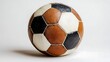 © thongsook - A classic football with white and black patches placed on a bright white background, showcasing tradition