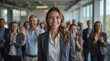 © NoblePix - Your moment to stand out. Image of a successful businesswoman receiving applause from her colleagues in the office. At last