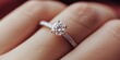 © irina - Beautiful diamond engagement ring shining on a hand with soft background highlighting romantic significance and precious moment in a cozy setting