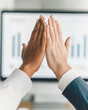 © Kowit - Celebrating success handshakes in a professional corporate meeting environment