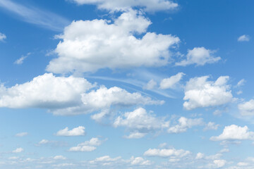 Wall Mural - Beautiful soft gentle blue sky with white cirrus and cumulus fluffy clouds background texture