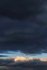 Wall Mural - Storm cloudy dramatic sky with dark rain grey cumulus cloud and blue sky background texture, thunderstorm, heaven