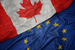 © luzitanija - waving colorful flag of canada and national flag of european union on the dollar money background. finance concept.