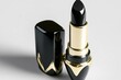 © Maria - bold black lipstick in glossy case with gold accents isolated on clean white background