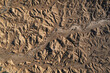 © ADDICTIVE STOCK - Aerial view of dramatic desert terrain and eroded formations