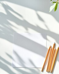 Poster - Morning Sunlit Study Desk with Pencils and Blank Paper Representing Education and Creativity