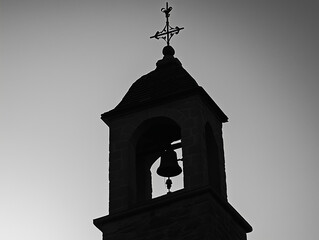 Silhouette of a Church Bell Tower at Sunset