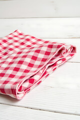 Aufkleber - A red checkered fabric is set against a white wooden table as the main element for a decorative key visual image._00002_