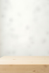 Poster - A minimalist wooden tabletop sits atop a soft focus white background with subtle hints of blur and texture surrounding it._00002_
