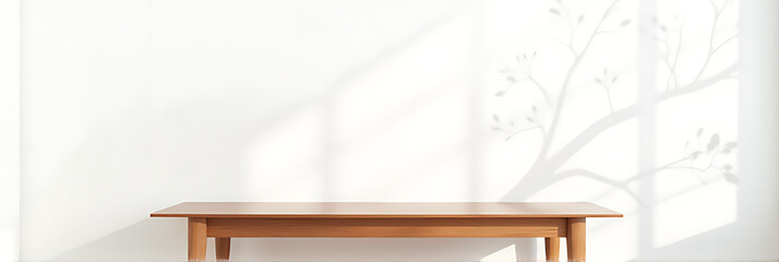 Aufkleber - A minimalist wood table stands against a white wall with a natural tree leaf pattern serving as a design element._00003_
