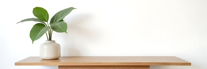 Aufkleber - A minimalist wood table stands against a white wall with a natural tree leaf pattern serving as a design element._00001_