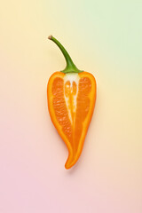 Poster - A colorful slice of chilli is placed on a soft pastel colored background creating a visually appealing image._00002_