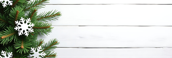 Wall Mural - a christmas fir tree is beautifully decorated with snowflakes and a pine branch, set against a white