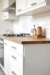 Poster - A beautiful end grain wood counter top blends perfectly with a white kitchen background in this clean and stylish montage display._00003_