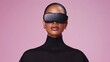 © Leo - Fashion-forward woman wearing futuristic VR glasses in a pink studio combining modern technology with bold personal expression in a vibrant setting