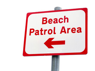 Wall Mural - A red and white sign pointing to the beach patrol area. The sign is on a pole and is placed on a white background