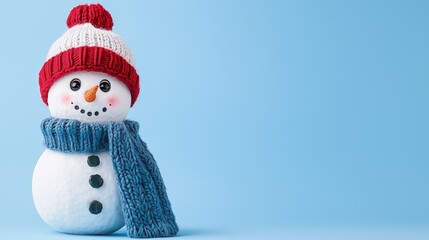 Wall Mural - Cute snowman wearing a hat and scarf on blue background.