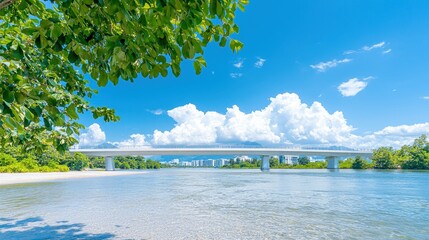 Wall Mural - Serene river scene with bridge under sunny sky.