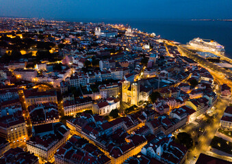 Wall Mural - Night aerial view of downtown of Lisbon overlooking medieval Cathedral and Castle of Sao Jorge, Portugal