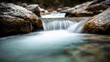 © Smart AI - Smooth flowing stream with rocks in tranquil setting