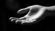 © Thuntaree - Open Hand Gesture in Black and White Against Dark Background