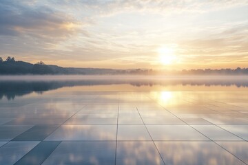 Wall Mural - Serene sunrise over a reflective lake with mist and tiled surface.