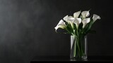 A bouquet of white calla lilies in a modern glass vase on a minimalist black table, side view shot, Contemporary style