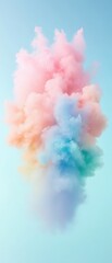 Wall Mural - A colorful cloud of smoke with a blue sky in the background