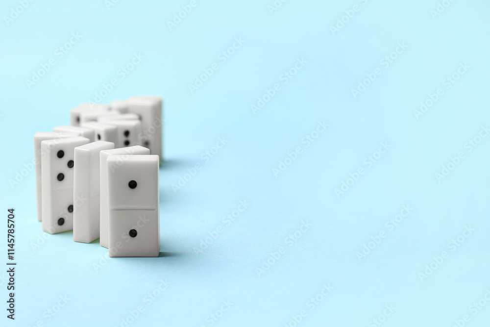 White dominos blocks in shape of zigzag on blue background